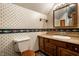 Charming bathroom with fish-themed wallpaper and decorative border at 4731 Moss Creek Ct, Indianapolis, IN 46237