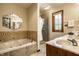 Luxurious bathroom with a soaking tub, walk-in shower, and elegant finishes, perfect for relaxation at 4731 Moss Creek Ct, Indianapolis, IN 46237