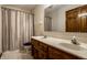 Functional bathroom with double sinks, ample lighting, and a shower-tub combo, designed for everyday convenience at 4731 Moss Creek Ct, Indianapolis, IN 46237