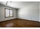 Bright bedroom with hardwood floors and a window providing natural light at 4731 Moss Creek Ct, Indianapolis, IN 46237