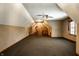Large bonus room with neutral carpet and unique ceiling with great natural light at 4731 Moss Creek Ct, Indianapolis, IN 46237