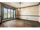 Elegant dining room featuring large window, neutral wall paint, and natural lighting at 4731 Moss Creek Ct, Indianapolis, IN 46237