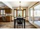 Dining room with wood trim and large bay window adjacent to the kitchen at 4731 Moss Creek Ct, Indianapolis, IN 46237
