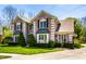 Gorgeous brick home featuring a well-maintained lawn, showcasing a blend of elegance at 4731 Moss Creek Ct, Indianapolis, IN 46237