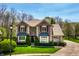 Charming brick home features a neatly landscaped front yard with mature trees and bushes that enhance curb appeal and privacy at 4731 Moss Creek Ct, Indianapolis, IN 46237