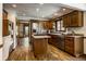 Spacious kitchen with stainless steel appliances, wooden cabinets, and a center island at 4731 Moss Creek Ct, Indianapolis, IN 46237