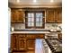 Eat-in kitchen featuring stainless steel appliances, oak cabinets, and stone countertops at 4731 Moss Creek Ct, Indianapolis, IN 46237