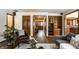 Spacious living room with wood floors, built-in shelving, and open access to other areas of the home at 4731 Moss Creek Ct, Indianapolis, IN 46237