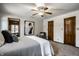 Spacious main bedroom featuring neutral tones, carpeted floors, and easy access to other rooms at 4731 Moss Creek Ct, Indianapolis, IN 46237