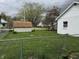Spacious backyard with a detached garage, shed, and chain-link fence at 518 N Grant St, Lebanon, IN 46052