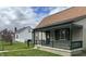 Inviting bungalow-style home with a covered front porch, complemented by well-kept landscaping at 518 N Grant St, Lebanon, IN 46052