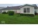 Beautiful backyard featuring green grass and well-placed shrubbery, creating a private outdoor space at 5341 Spring Creek Ct, Indianapolis, IN 46254