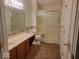 Bathroom showing a vanity with a sink, a toilet, and a walk-in shower with glass doors at 5341 Spring Creek Ct, Indianapolis, IN 46254