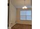 Cozy bedroom featuring carpeted floors, a window with blinds, and a warm, inviting atmosphere at 5341 Spring Creek Ct, Indianapolis, IN 46254