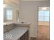 Bright kitchenette with white countertops and view to carpeted room with large window at 5341 Spring Creek Ct, Indianapolis, IN 46254