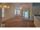 Spacious living room featuring vaulted ceilings, natural light, and glass doors leading to another room at 5341 Spring Creek Ct, Indianapolis, IN 46254