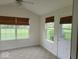 Bright sun room with carpeting and two large windows overlooking backyard at 5341 Spring Creek Ct, Indianapolis, IN 46254