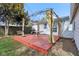 Backyard featuring a pergola-covered deck, a grill, and a well maintained lawn at 540 S Broadway St, Atlanta, IN 46031