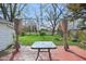 Backyard featuring a pergola-covered deck, a fire pit, and a lush green lawn at 540 S Broadway St, Atlanta, IN 46031