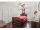 Bedroom with a dark wood bed frame and ceiling fan at 540 S Broadway St, Atlanta, IN 46031