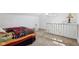 Attic bedroom with a colorful quilt, white trim, and cozy carpeting at 540 S Broadway St, Atlanta, IN 46031