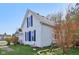 A charming home with crisp white siding, blue shutters, and a well-manicured lawn at 540 S Broadway St, Atlanta, IN 46031
