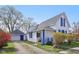 Charming home with blue shutters, a detached garage, and a well-maintained yard at 540 S Broadway St, Atlanta, IN 46031