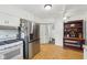 Functional kitchen featuring modern refrigerator and adjacent breakfast nook at 540 S Broadway St, Atlanta, IN 46031