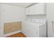 Laundry room featuring a washer, dryer, and overhead storage at 540 S Broadway St, Atlanta, IN 46031