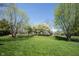 Spacious lawn with scattered, mature trees at 5624 Ottawa Pass, Carmel, IN 46033
