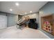 Finished basement playroom with stairs, entertainment center, and barn door at 5624 Ottawa Pass, Carmel, IN 46033