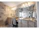 Luxurious bathroom with double vanity, granite countertops, and tiled accent wall at 5624 Ottawa Pass, Carmel, IN 46033