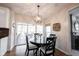 Dining area with sliding glass doors leading to the screened-in porch at 5624 Ottawa Pass, Carmel, IN 46033