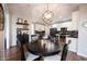 Dining area with stylish light fixture adjacent to the kitchen at 5624 Ottawa Pass, Carmel, IN 46033