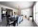 Elegant dining room with stylish furniture, lighting, and neutral color scheme at 5624 Ottawa Pass, Carmel, IN 46033