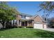 Charming two-story brick home featuring a well-manicured lawn and a spacious three-car garage at 5624 Ottawa Pass, Carmel, IN 46033