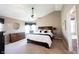 Serene main bedroom with a vaulted ceiling, dresser, and a cozy sitting area at 5624 Ottawa Pass, Carmel, IN 46033
