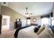 Spacious main bedroom showcasing a ceiling fan and ensuite bathroom access at 5624 Ottawa Pass, Carmel, IN 46033