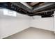 Unfinished basement offering painted walls, exposed ducts and beams at 5933 Guilford Ave, Indianapolis, IN 46220