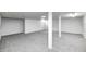Partially finished basement offering carpet floors and support columns at 5933 Guilford Ave, Indianapolis, IN 46220