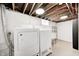 Basement laundry room with washer, dryer, and utility sink at 5933 Guilford Ave, Indianapolis, IN 46220
