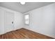 Bedroom featuring hardwood floors, natural light, and neutral walls and trim at 5933 Guilford Ave, Indianapolis, IN 46220