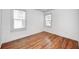 Bedroom with hardwood floors, natural light, and neutral colored walls at 5933 Guilford Ave, Indianapolis, IN 46220