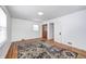 Bedroom with hardwood flooring and neutral color area rug, white walls, and natural light from the window at 5933 Guilford Ave, Indianapolis, IN 46220