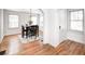 Charming dining room with hardwood floors, a chandelier, and a view of an arched doorway at 5933 Guilford Ave, Indianapolis, IN 46220