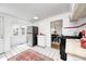 Bright kitchen featuring white cabinets, a stainless steel gas range and oven and a decorative area rug at 5933 Guilford Ave, Indianapolis, IN 46220