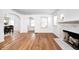 Inviting living room featuring hardwood floors, a marble fireplace, and arched doorways at 5933 Guilford Ave, Indianapolis, IN 46220