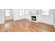 Spacious living room with hardwood floors, marble fireplace, and plenty of natural light at 5933 Guilford Ave, Indianapolis, IN 46220