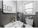Charming bathroom with brushed gold faucet and modern fixtures creates an inviting atmosphere at 6223 N Parker Ave, Indianapolis, IN 46220