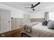 Stylish bedroom with hardwood floors, modern decor, and a ceiling fan at 6223 N Parker Ave, Indianapolis, IN 46220